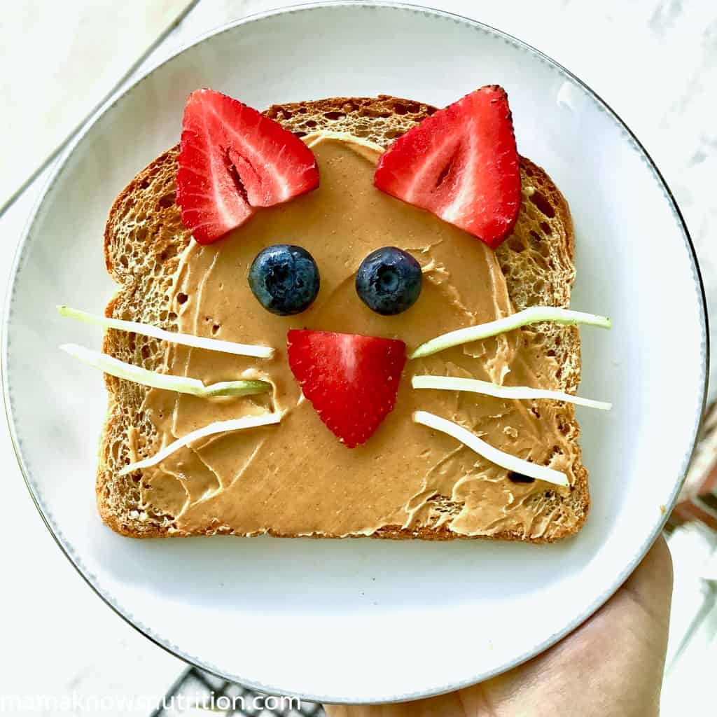 cute food art animal face on toast with broccoli whiskers