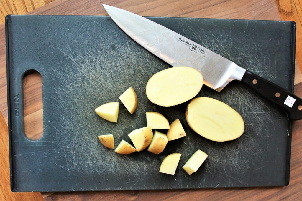 chopped potato on cutting board