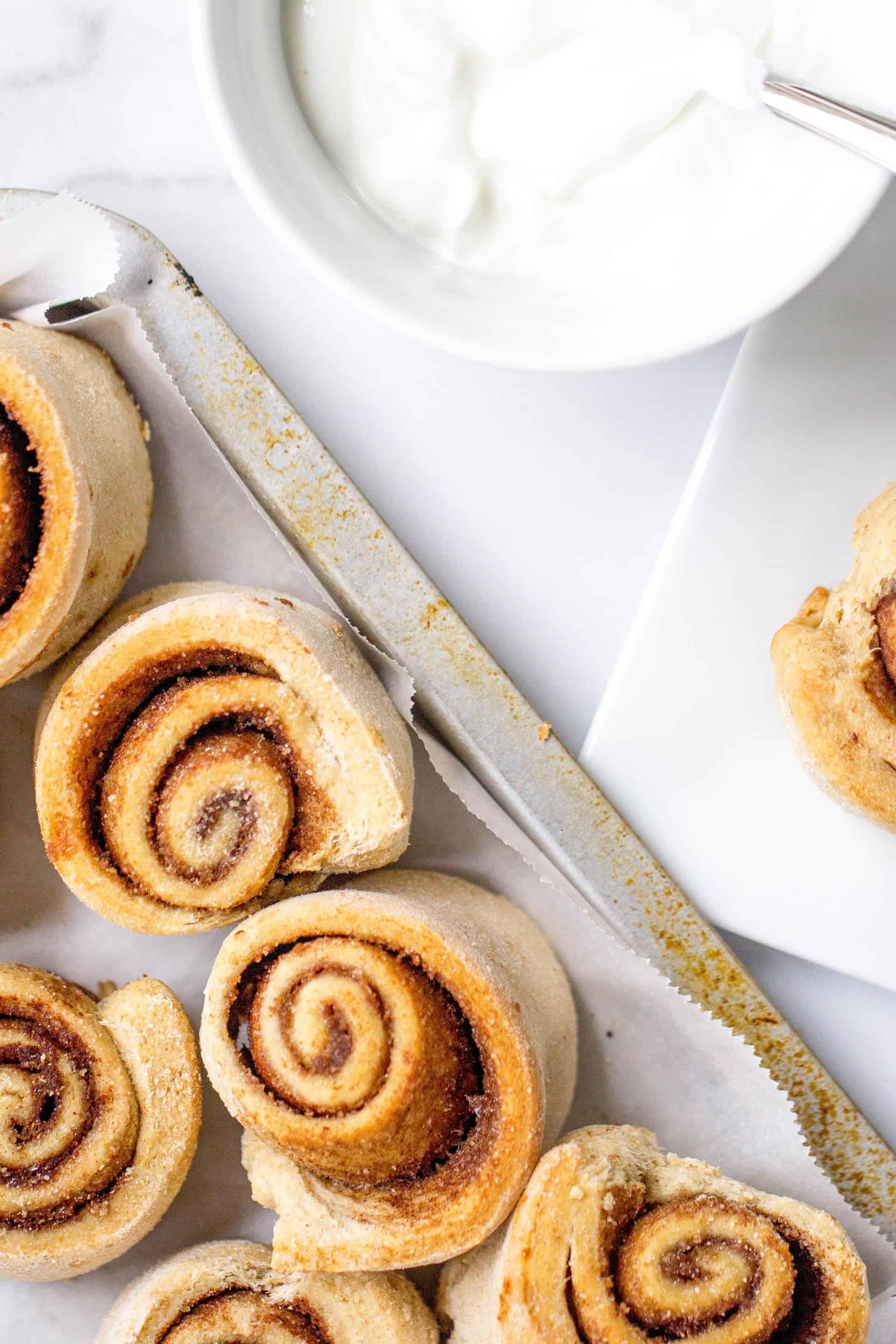 A plate of food on a table, with Cinnamon Roll