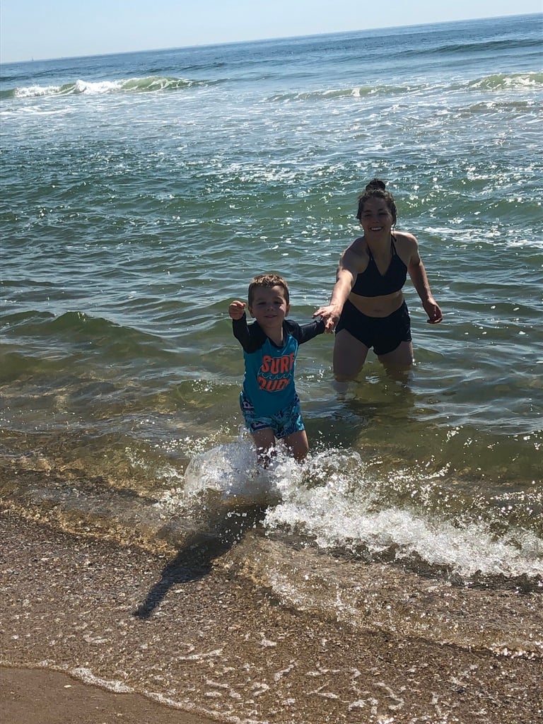 kacie barnes and son at beach