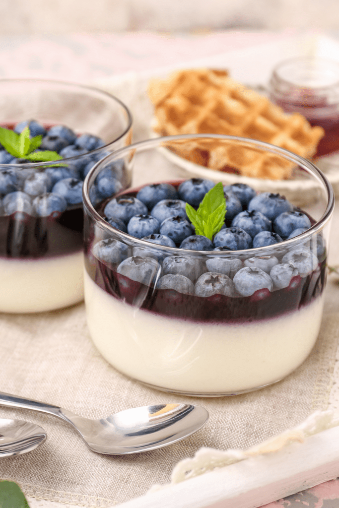 sugar in yogurt with yogurt on bottom and blueberries on top