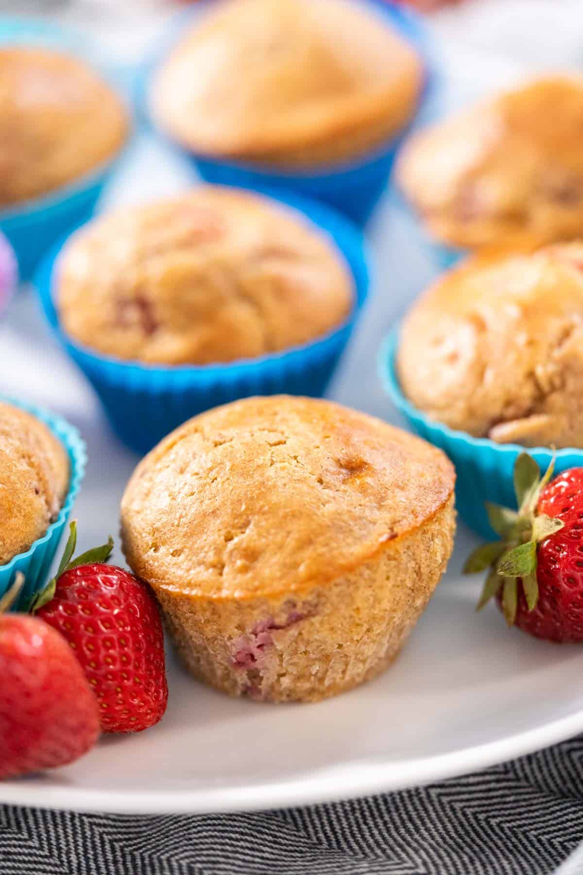 white whole wheat strawberry muffins with fresh strawberries