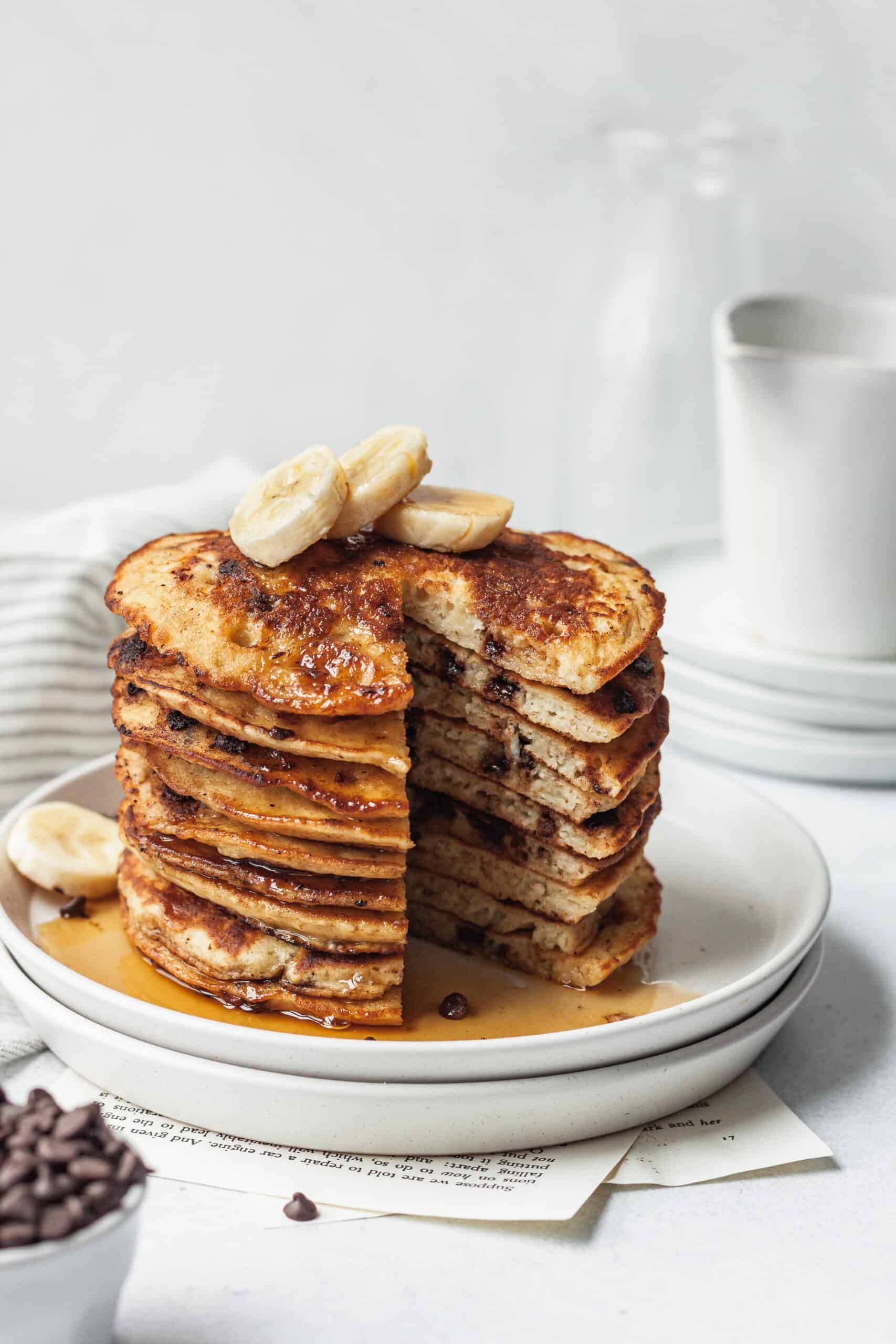 sliced stack of banana chocolate chip pancakes