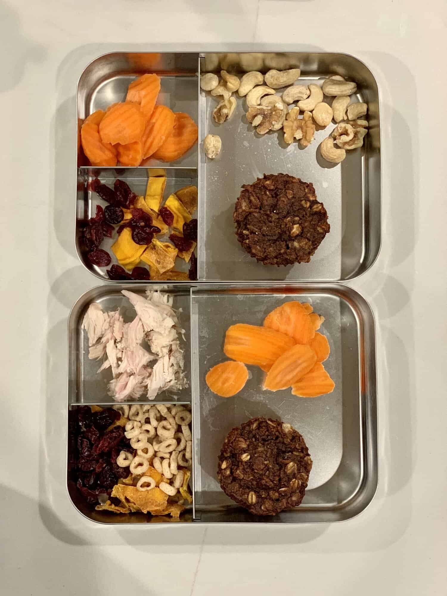 packed lunches with muffins and fruit and carrots