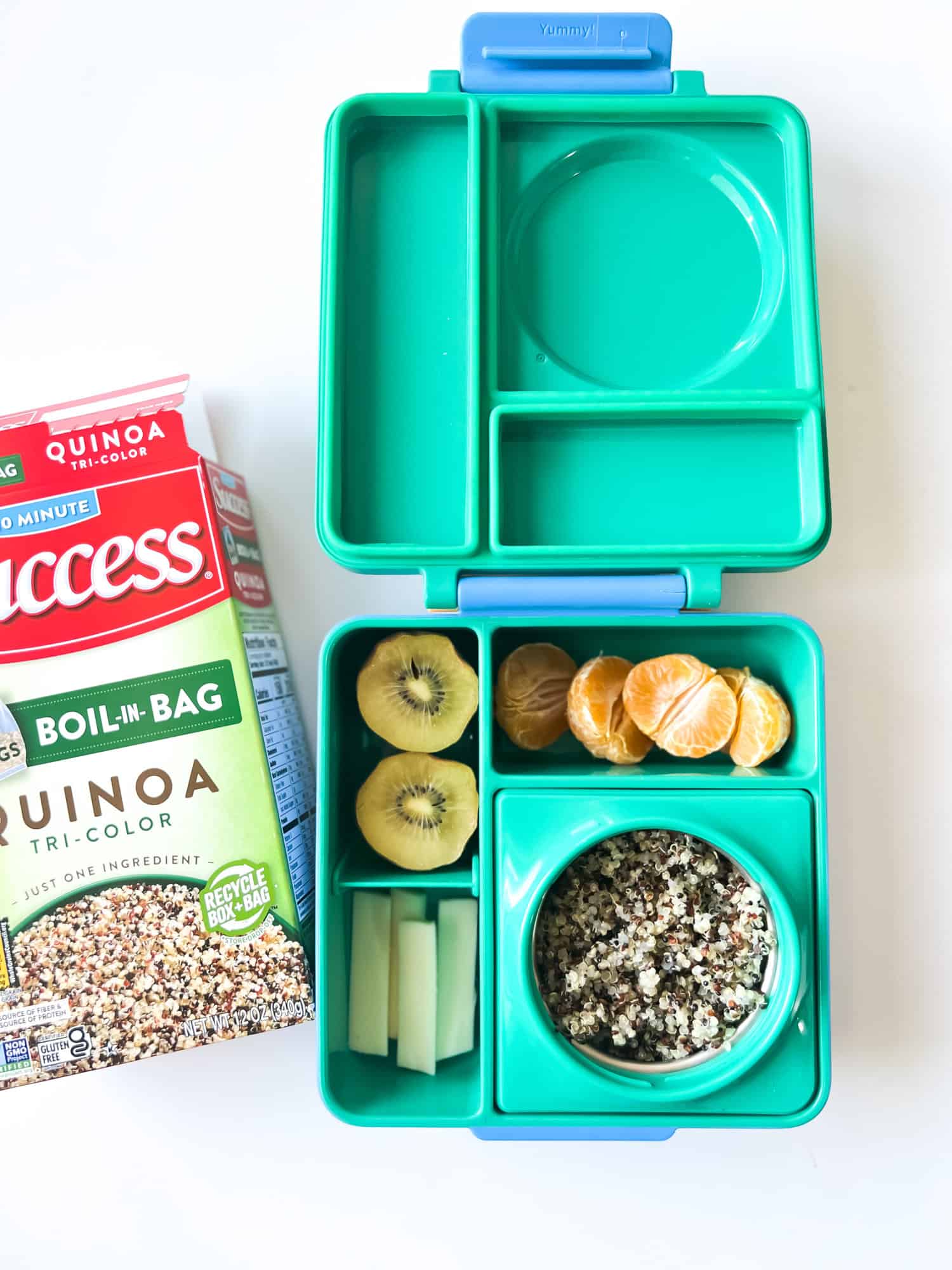 Green lunch box with Succes Rice Quinoa Box