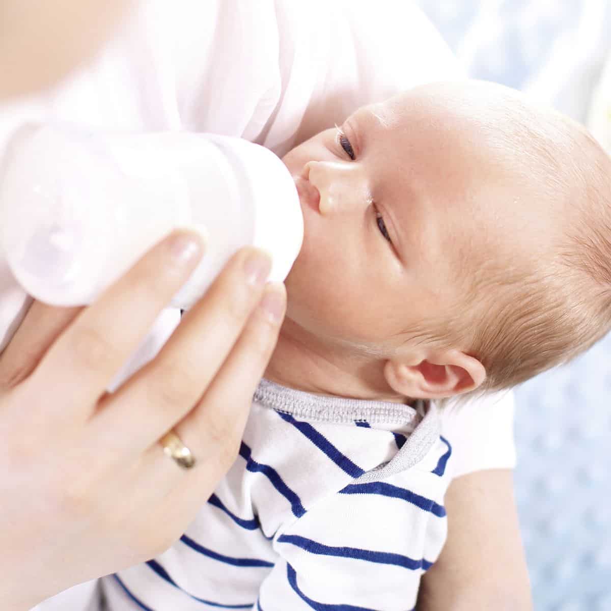 Baby being bottle fed