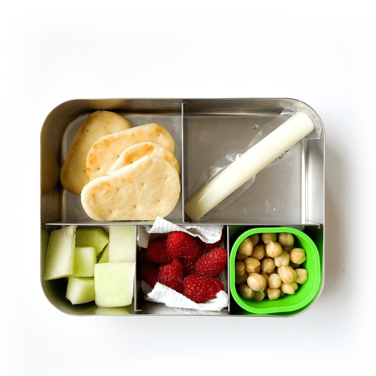 Packed lunchbox with crackers, cheese, fruit and chickpeas 