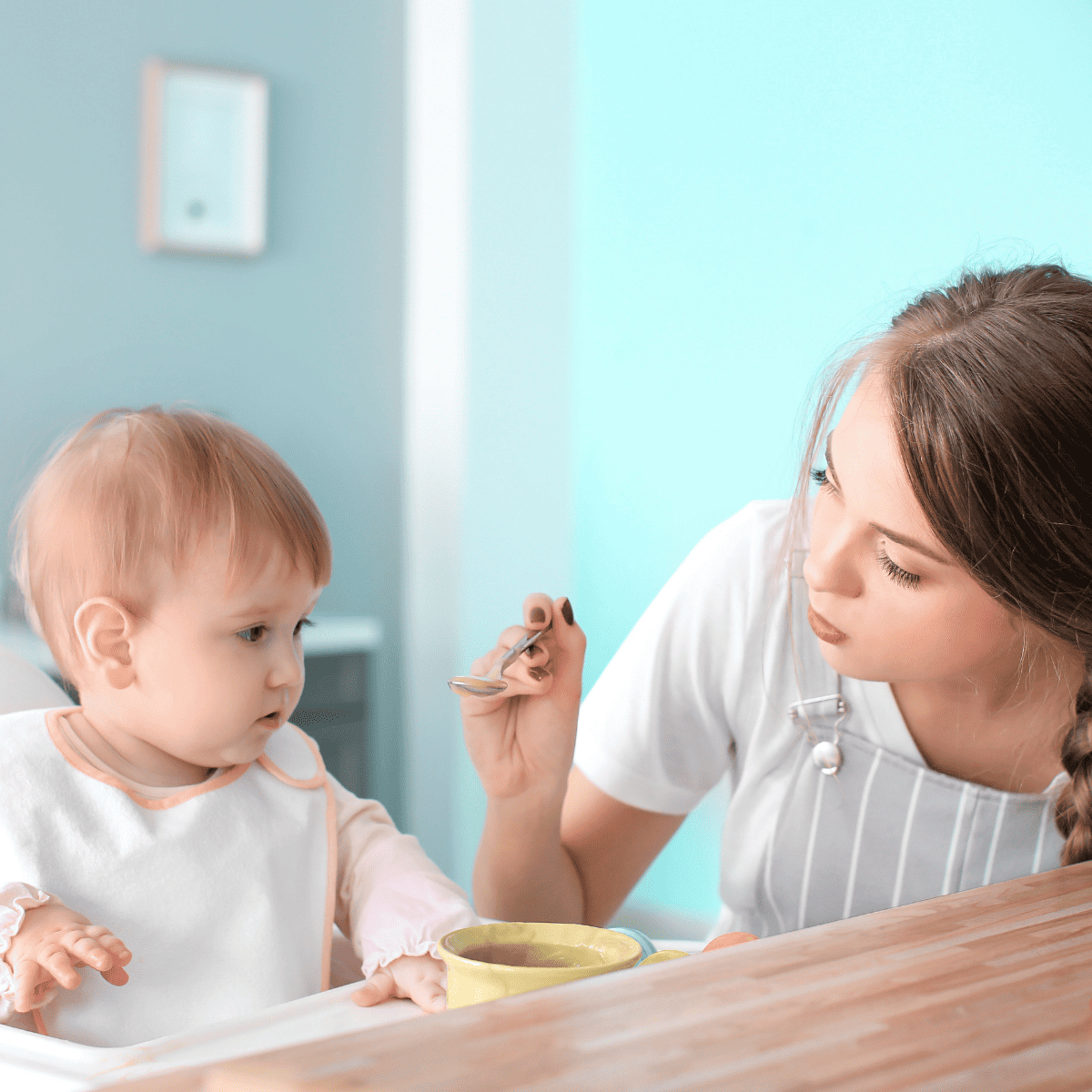 babysitter feeding child