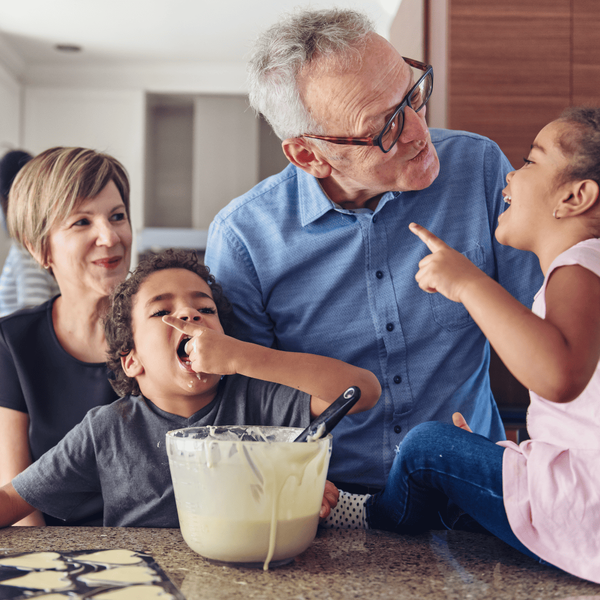 grandparents making pancakes with kids