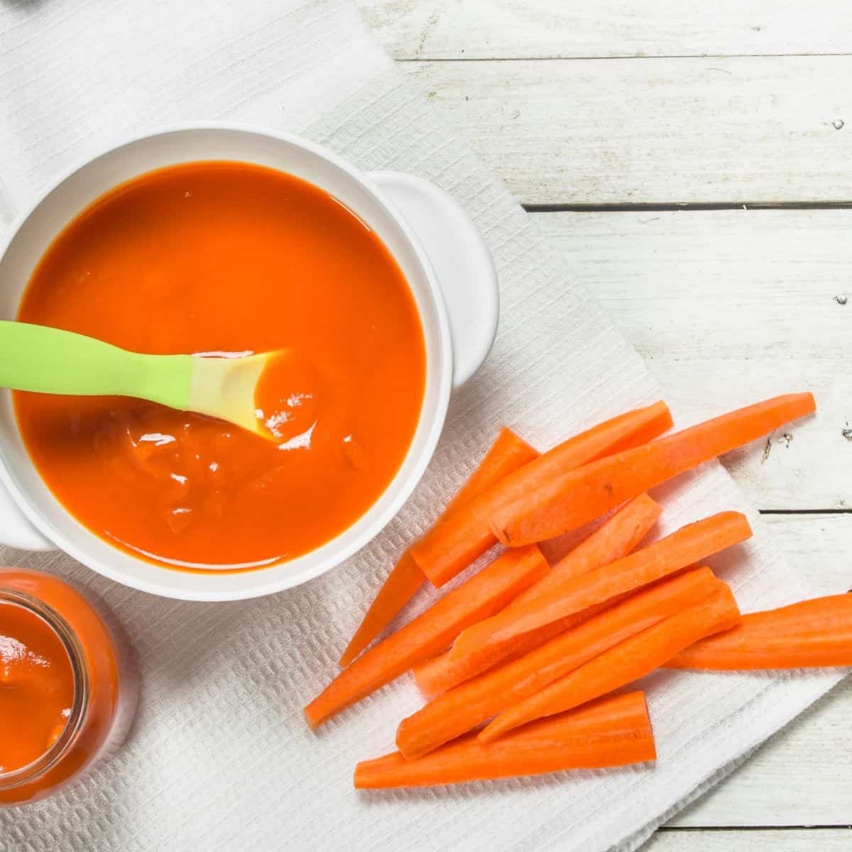 baby food puree with carrots in a white bowl