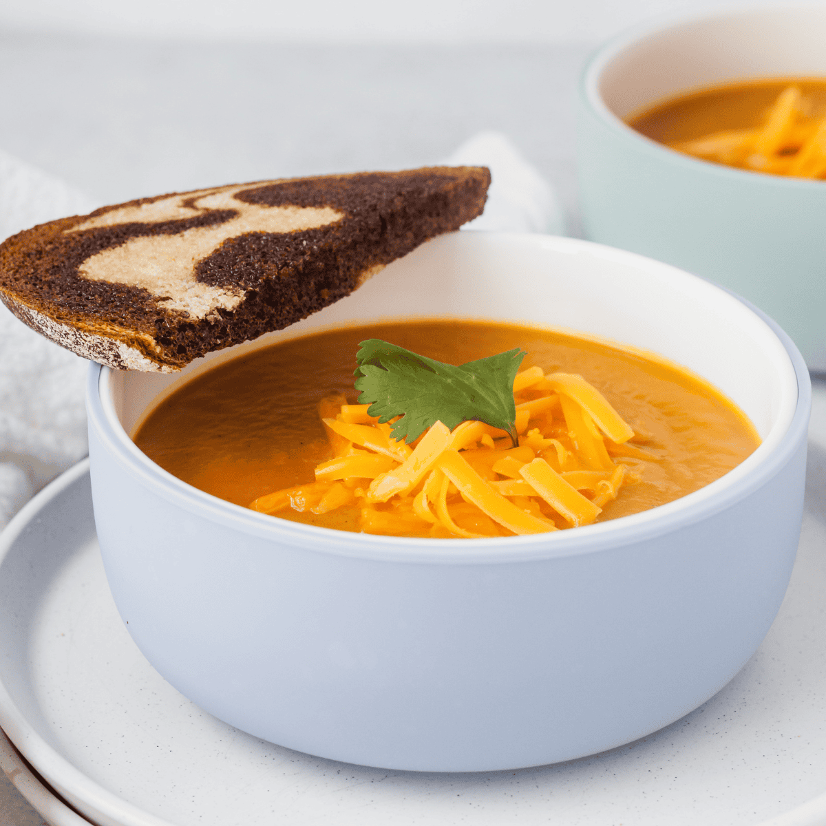 creamy pumpkin soup served with bread