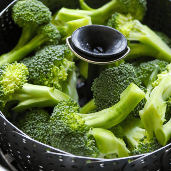 broccoli florets in a steaming basket