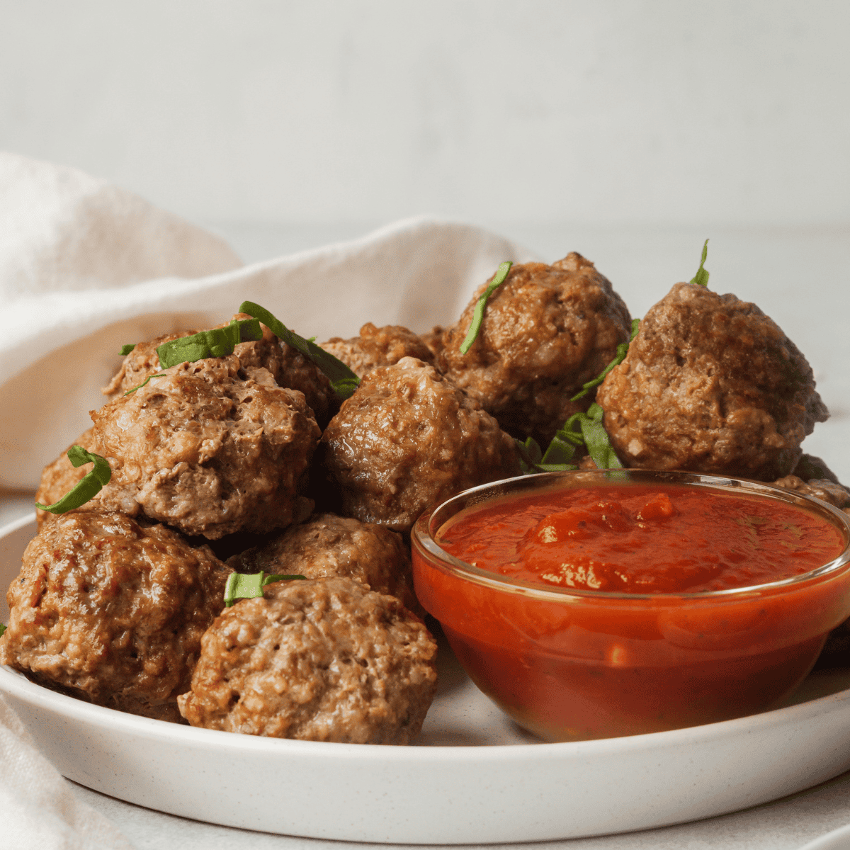 plate of mini meatballs and sauce