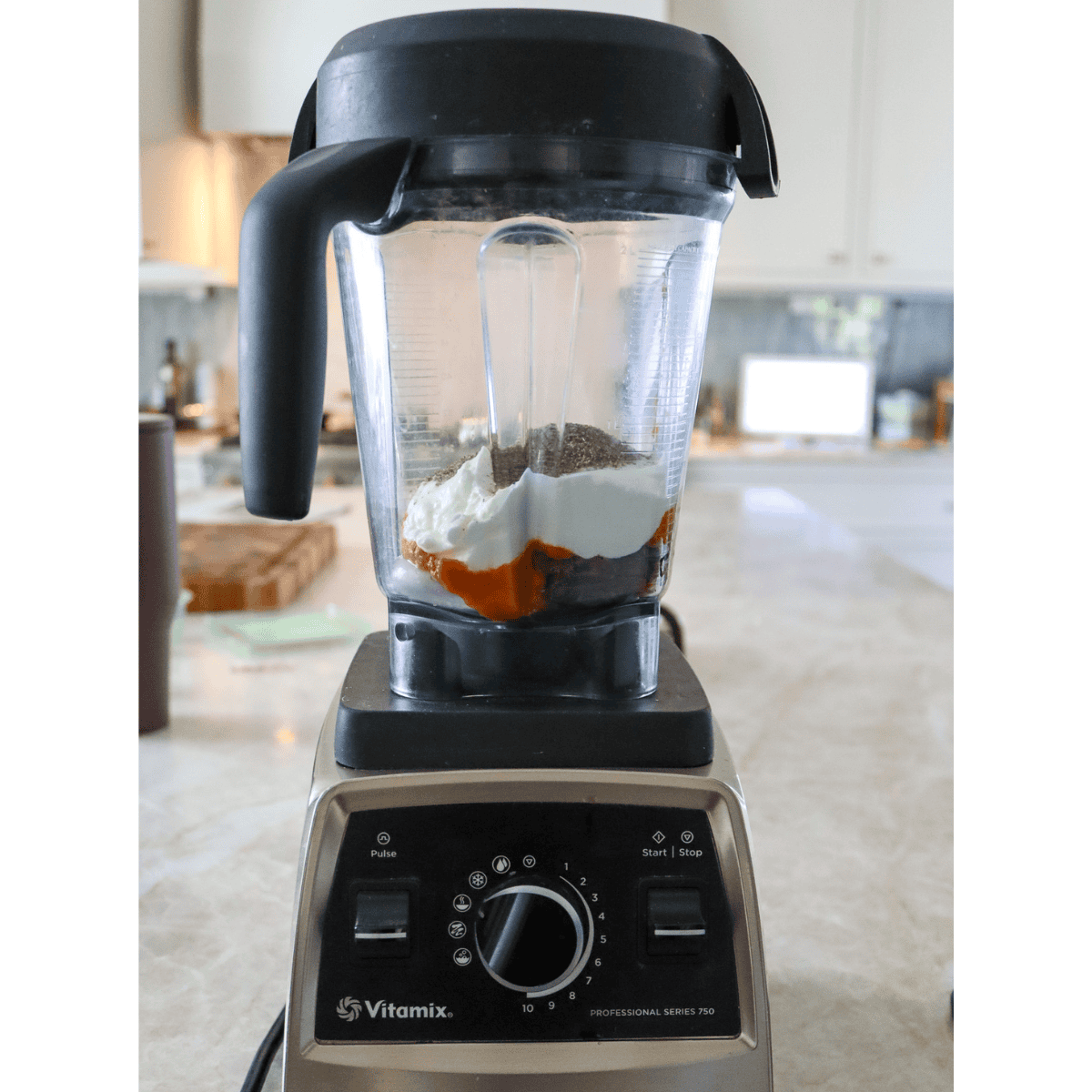 vitamix blender with ingredients for pumpkin pie smoothie